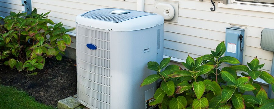 Outdoor Carrier air conditioning unit beside a Springfield home