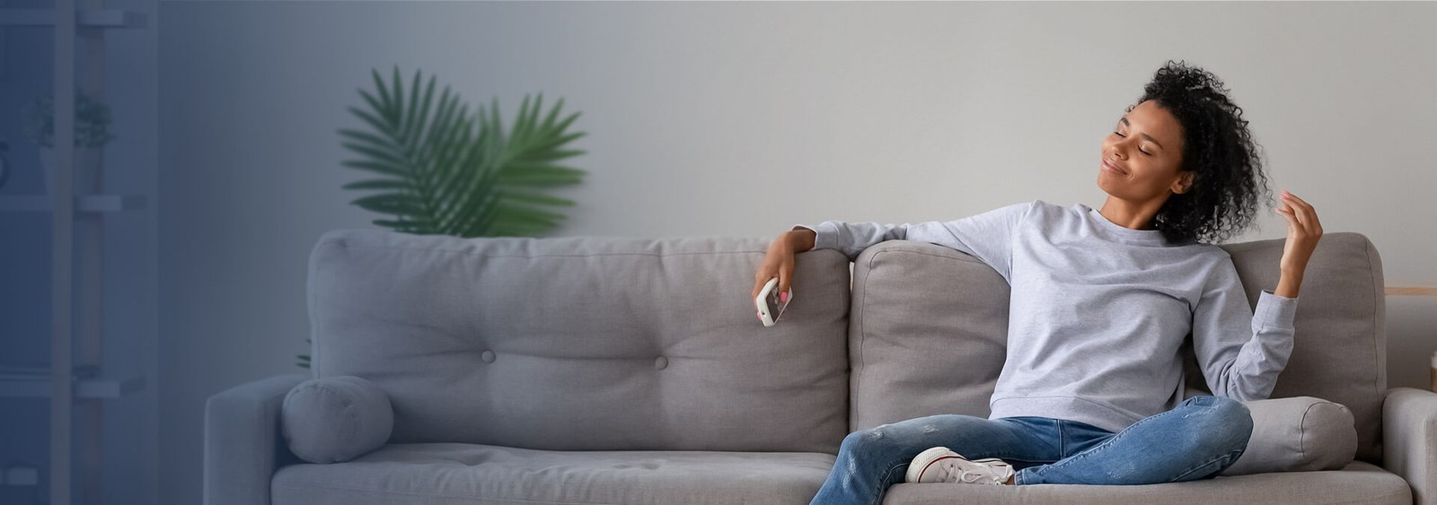 Homeowner relaxing comfortably on her couch