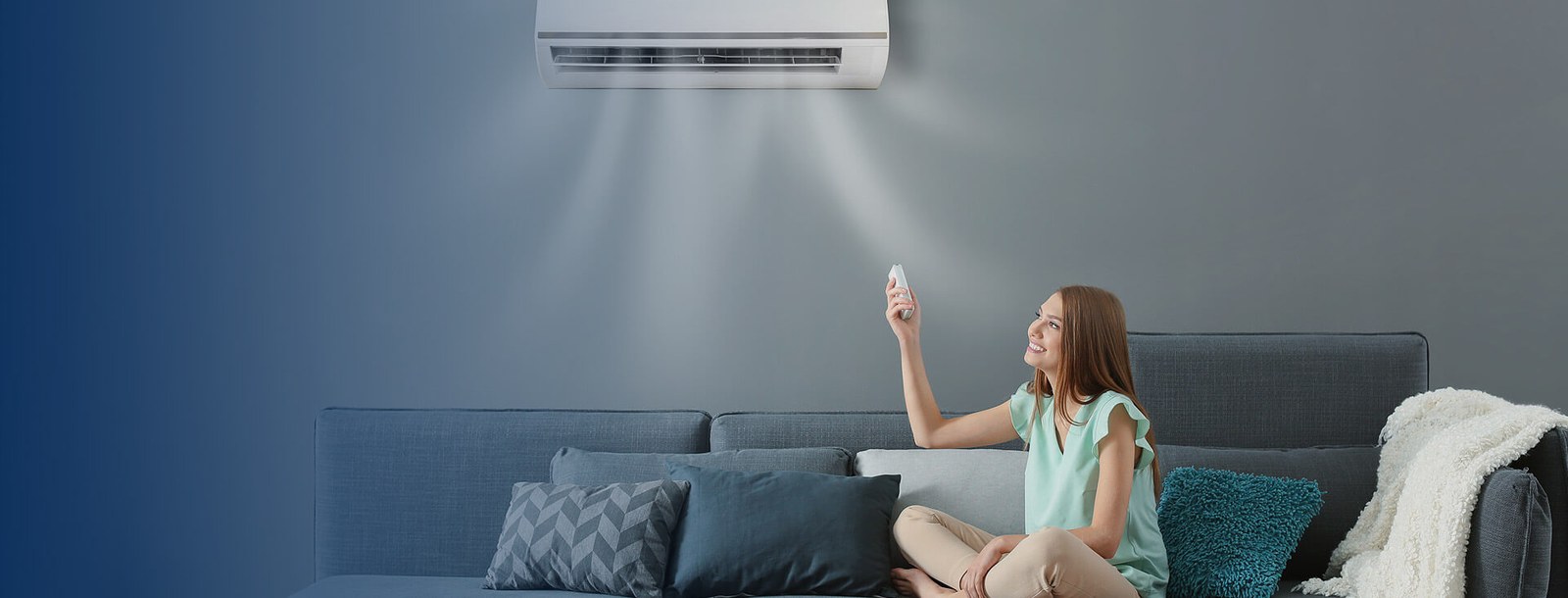 Homeowner relaxing under a wall-mounted air conditioner